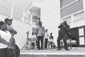 Dion “Mega D” Humphreys (right) and Gerson Herrera performing at the school grounds in St. John’s.