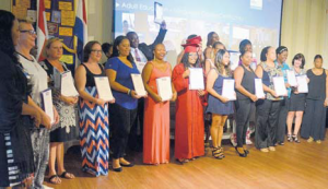 Saba Reach’s adult students proudly showing their language course certificates.