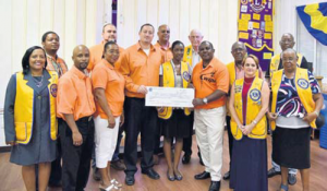 WIPM party members and Saba Lions Club representatives during the cheque presentation.