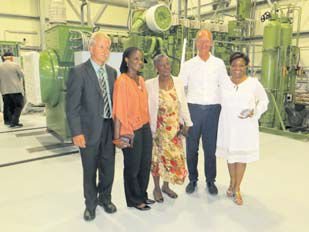 Minister of Economic Affairs Henk Kamp (second right) posing inside Saba Electric Company’s new Elmer Linzey power plant with SEC Director Dexter Johnson (left), and Edwina Linzey (centre), widow of SEC founder Elmer Linzey (centre) and their two daughters.